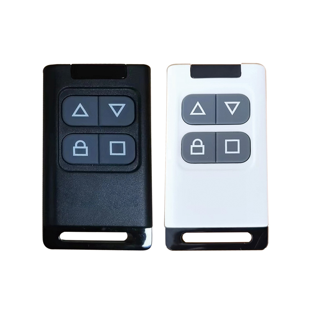 Supplied photograph of black and white rectangular hand-held controls, reference R5